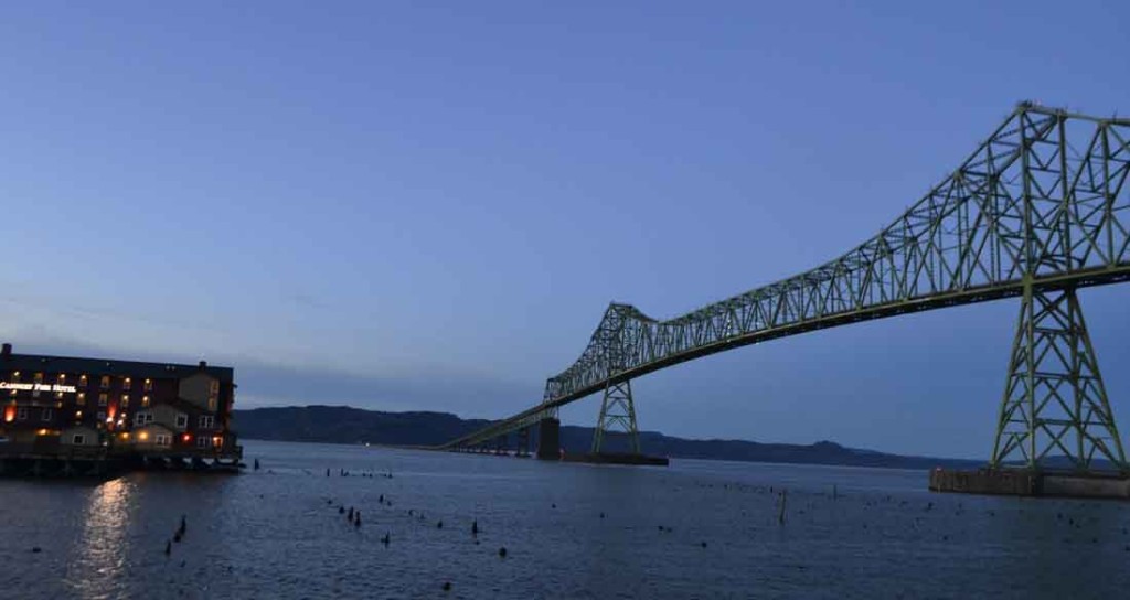 The Cannery Pier Hotel is a perfect nighttime juxtaposition to Astoria's Columbia River bridge.